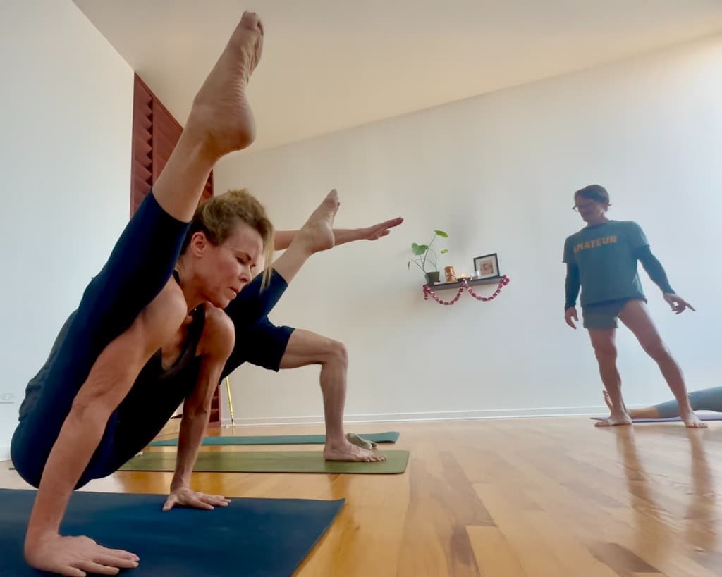 Students practicing together at Ashtanga Yoga Denver